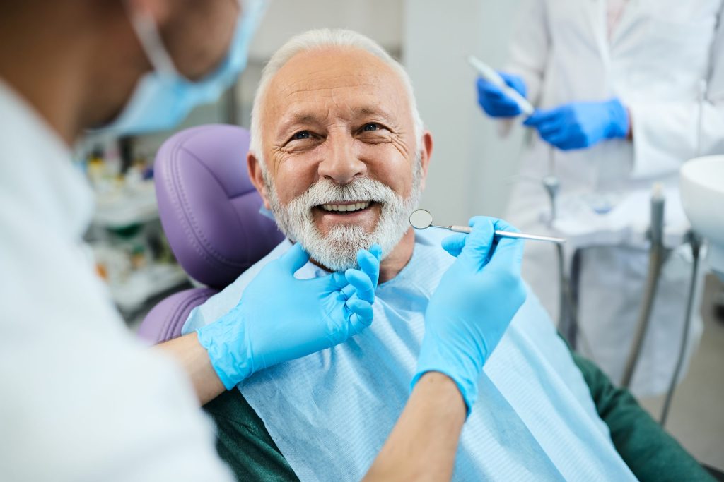 Smiling senior patient during a dental cleaning